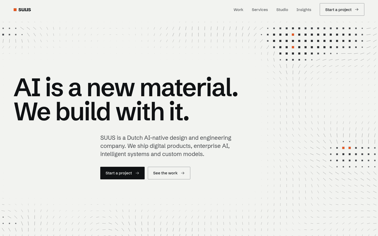 The suus.ai homepage hero: the headline AI is a new material. We build with it. over a field of computed cells.